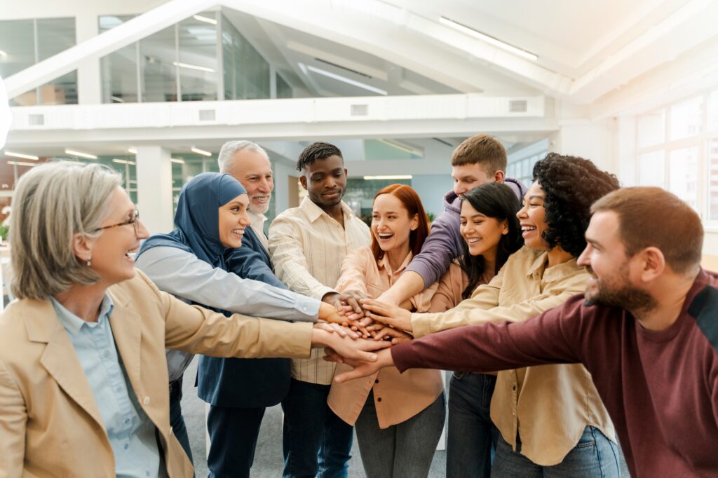 Group of happy business people greeting, holding hands, support each other. meeting, teamwork