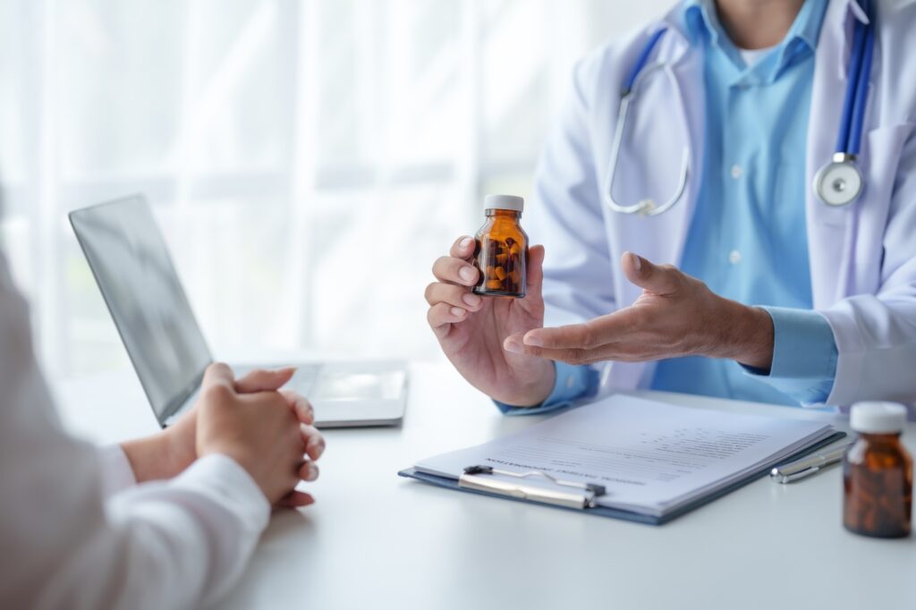 Doctor who records a patient's detailed information or medication history is evaluating medications