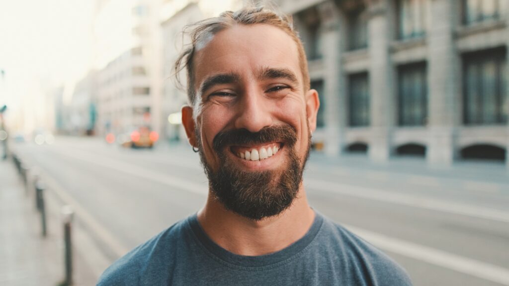Close-up of young man with beard looking at the camera
