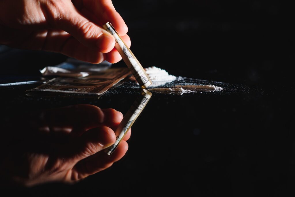 Hard drugs on black table. Close up.