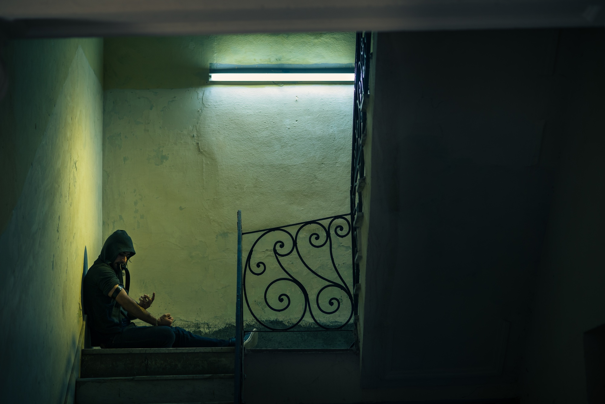 Young Drug Addict Shooting Up Heroin In Abandoned House